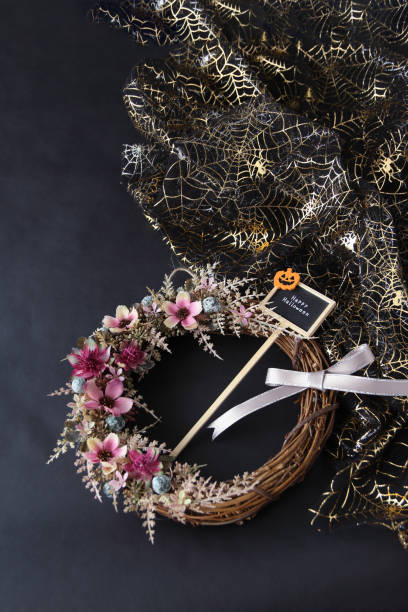 istock cosmos flower wreath and halloween 1165307283