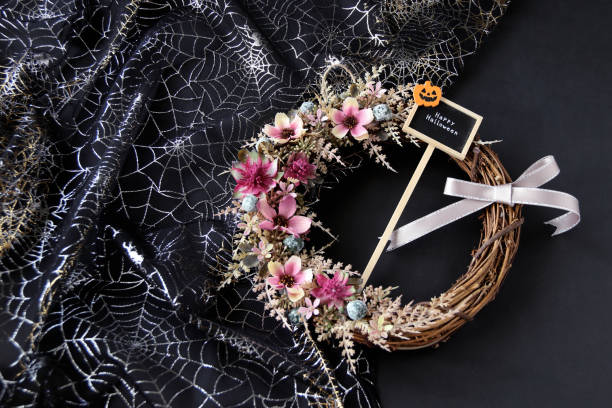 istock cosmos flower wreath and halloween 1165307687