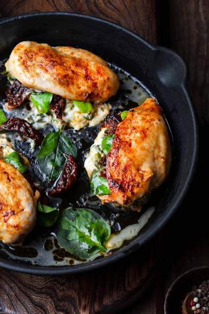 istock Baked Chicken fillet stuffed with cheese and spinach 1165313596