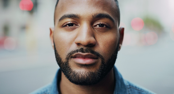 Portrait of a handsome young man in the city