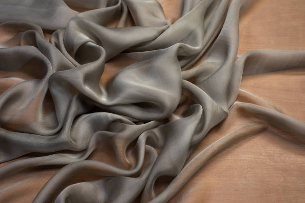 istock The texture of the silk fabric is gray. Background, pattern, chiffon. 1165319460