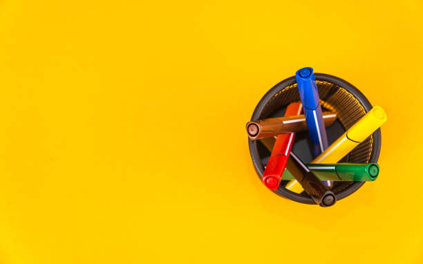 istock Pencil with pencil box on yellow background 1165322300