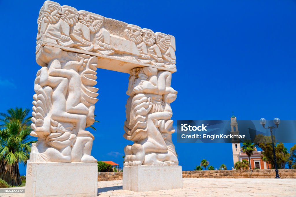 The Gate of Faith monument in Yafo, Israel Statue of Faith or Gate of Faith in Abrasha Park in the old city of Yafo. The monument depicts some biblical stories. Ancient Stock Photo