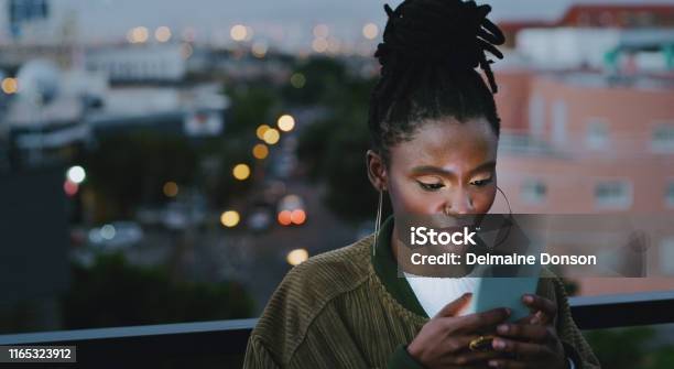 Stay Connected And Dont Get Left In The Dark Stock Photo - Download Image Now - African Ethnicity, Women, One Woman Only