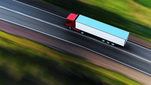 istock semi-truck with trailer driving on road 1165326631