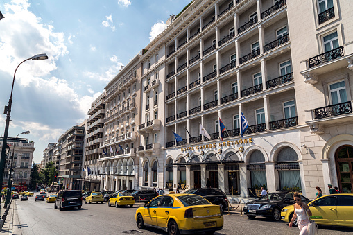 Athens, Greece - July 19, 2018: View from Syntagma Square of Athens, people walking around and generic architecture of the city.