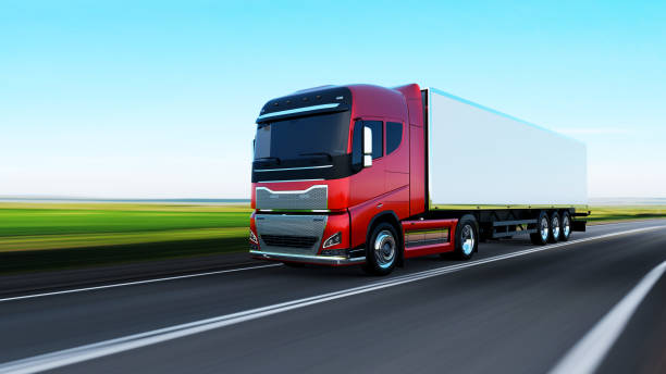 istock semi-truck with trailer driving on road 1165327395