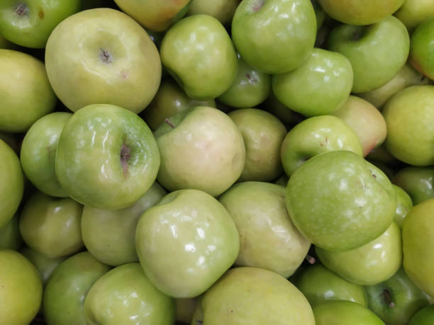 istock Green Apple Background, shallow depth of field. 1165329315