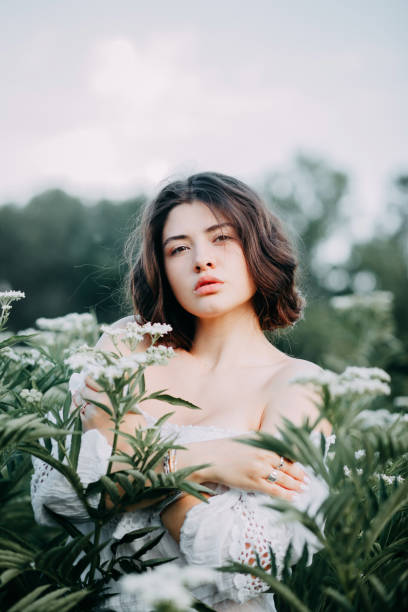 istock Beautiful girl in the field 1165332036