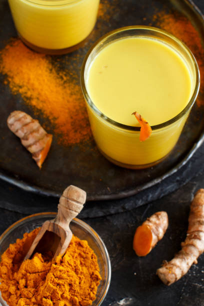 istock Golden milk with turmeric powder 1165333727