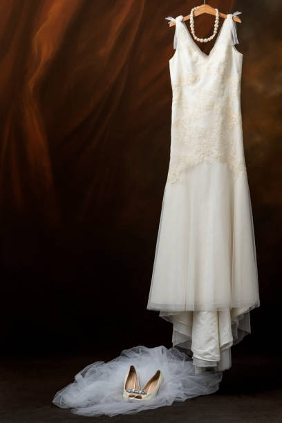 istock White modern wedding dresses with bridal shoes 1165334012