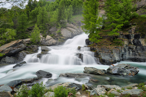 Lillaz waterfall among rocks, Aosta Valley, Alps of Italy