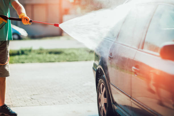 istock Car washing. Cleaning car using high pressure water. 1165336805