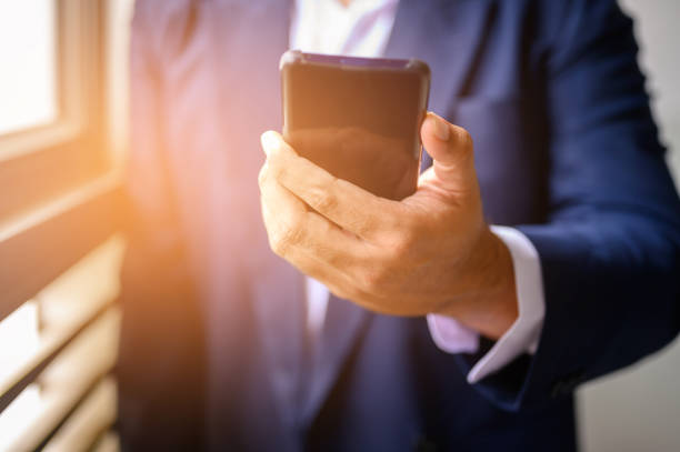 istock Businessmen check email via mobile phone. 1165339145