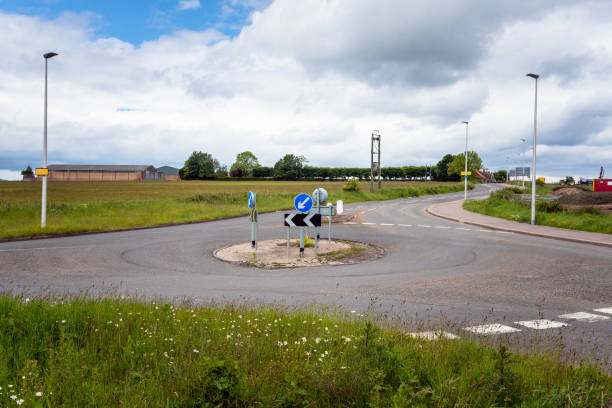 istock View of an empty roundabout and cloudy sky 1165340196
