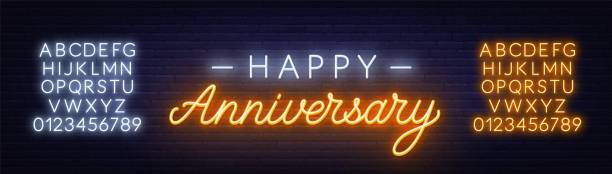 happy anniversary neon sign. kartka z życzeniami na ciemnym tle. - metallic wall brick glowing stock illustrations