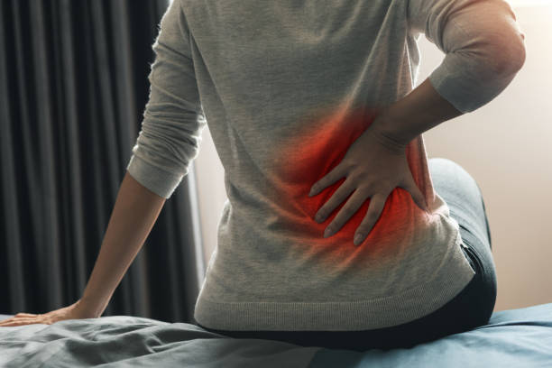 istock woman suffers from backache 1165340547