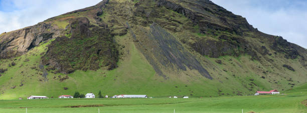 istock Farm buildings under a hill near Vik. 1165340784