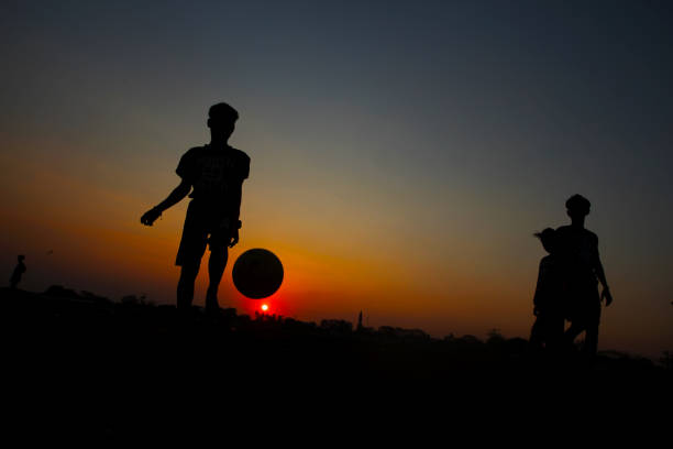 istock Children playing football 1165343143