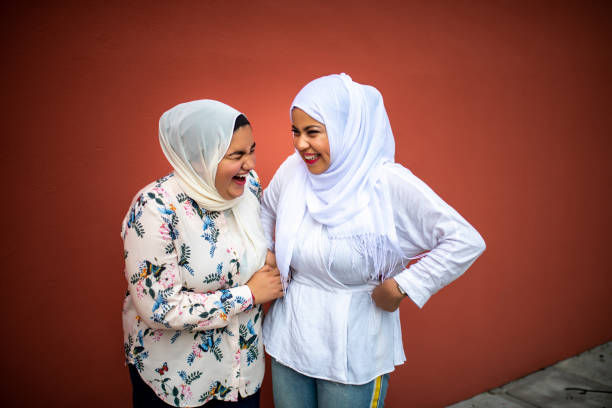 istock Two Muslim friends laughing. 1165343185