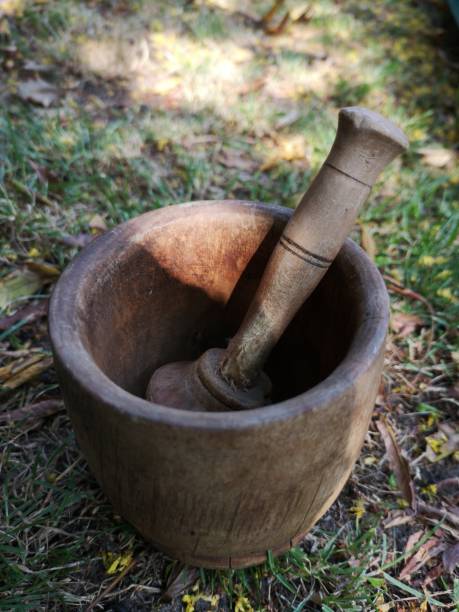 istock Antique wooden mortar with grinder. 1165343460