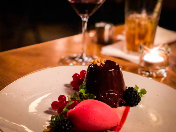 istock chocolate lava cake with red berry sorbet 1165343748