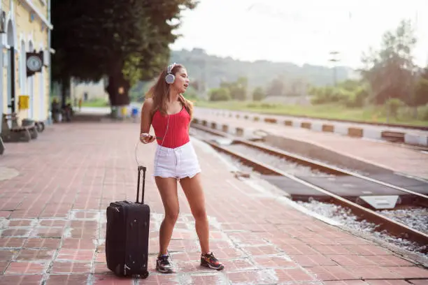 Photo of Girl waiting for train transport.