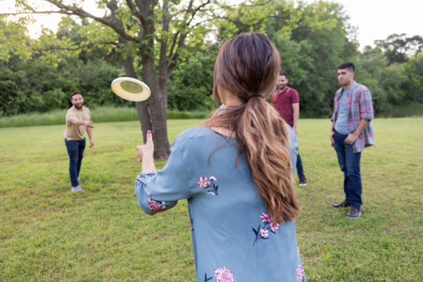istock Young woman tosses plastic disc 1165344879