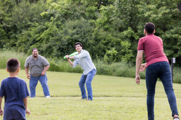istock Family playing baseball together 1165344884