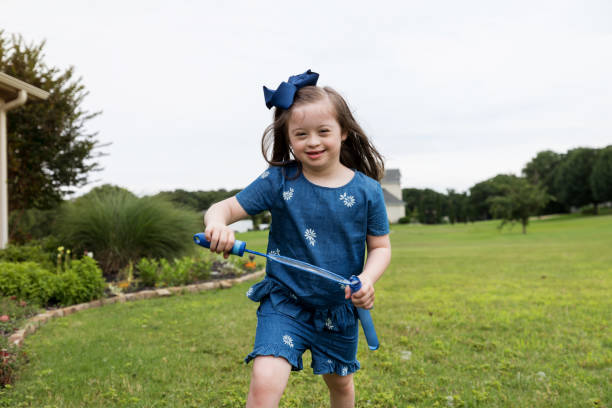 istock Smiling little girl plays outside 1165345109