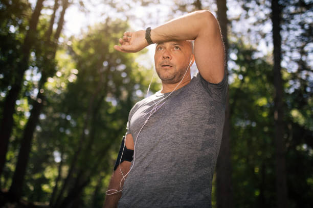 istock Hardworking retired athlete standing in the hot sun 1165346238