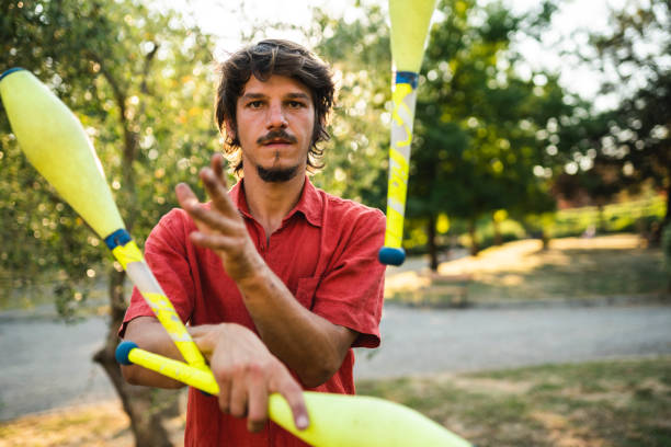 istock Young adult juggler training at the park 1165346507
