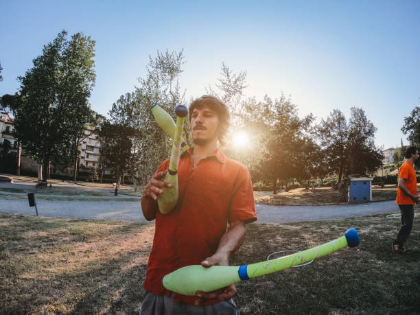 istock Young adult juggler training at the park 1165346563