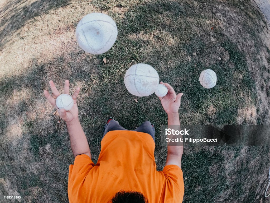 Pov view of a juggler performing at the park Juggling Stock Photo