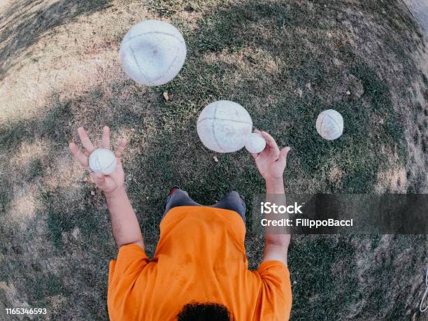 Pov View Of A Juggler Performing At The Park Stock Photo - Download Image Now - Juggling, Sports Ball, Sphere