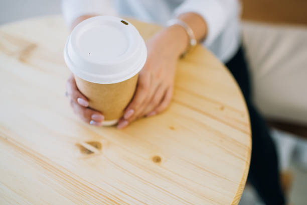 istock Female hands holding recyclable coffee cup. 1165346626