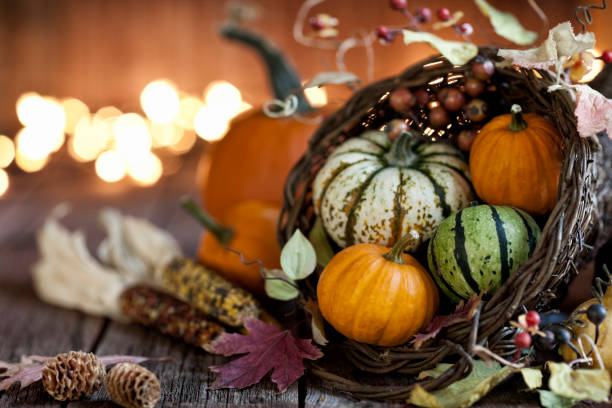 istock Autumn Thanksgiving cornucopia on a wood background 1165352044