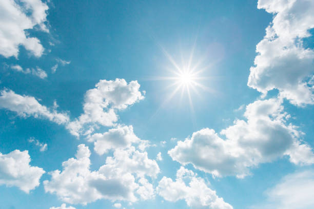istock Sunny background, blue sky with white clouds and sun. 1165353005