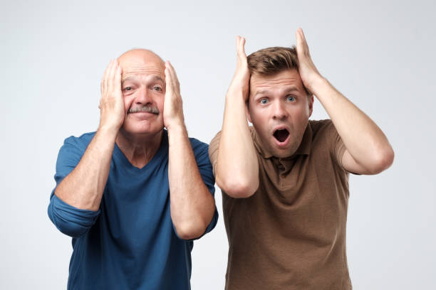 istock Two men mature father and son excited shocking. 1165354381