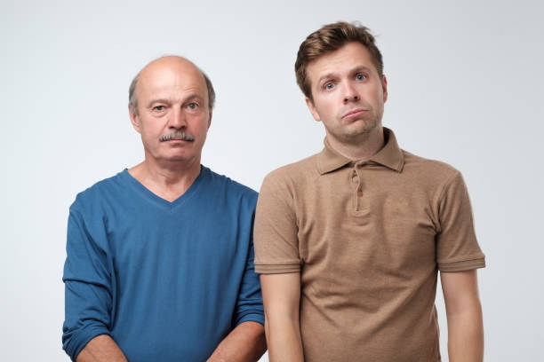 istock Two mature men father and son being sad. 1165355099