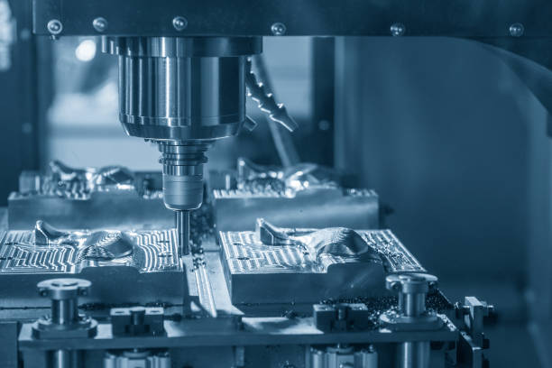 istock The CNC milling machine rough cutting the mould part by index-able tool. 1165355959