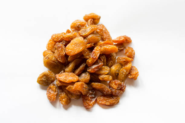 Dry raisins in white background stock photo