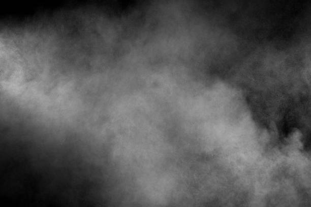 istock White smoke blow on dark background. 1165359874