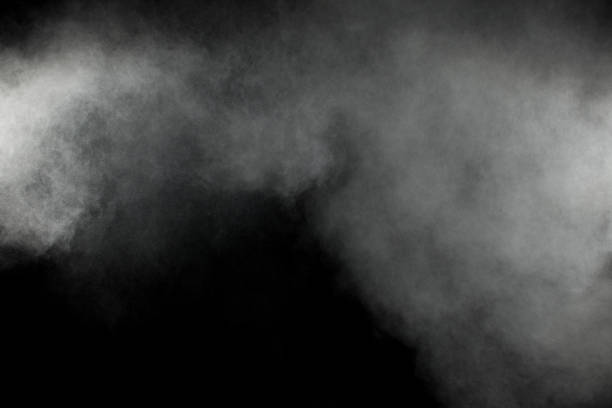 istock White smoke blow on dark background. 1165359876