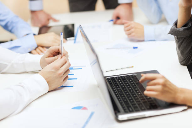 istock close up of files and laptop computer in office 1165359884