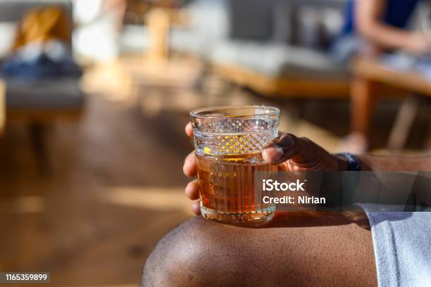 Hand Holding Glass With Old Fashioned Cocktail Stock Photo - Download Image Now - Rum, Whiskey, Cocktail