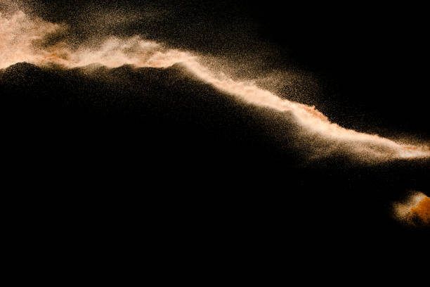 istock Dry river sand explosion isolated on black background. Abstract sand cloud.Brown colored sand splash against dark background. 1165360452