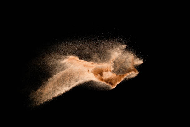 istock Dry river sand explosion isolated on black background. Abstract sand cloud.Brown colored sand splash against dark background. 1165360472
