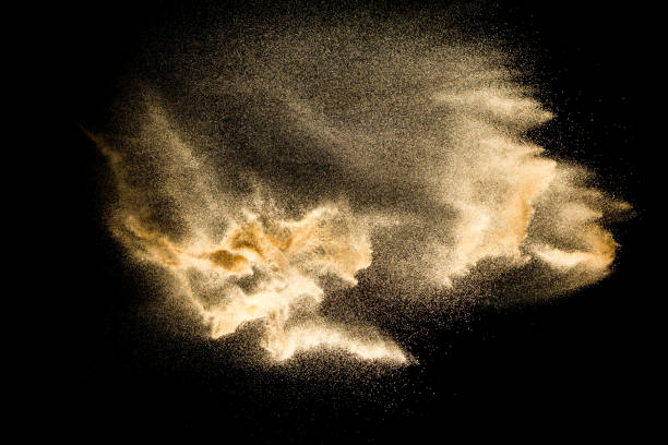 istock Dry river sand explosion isolated on black background. Abstract sand cloud.Brown colored sand splash against dark background. 1165360473