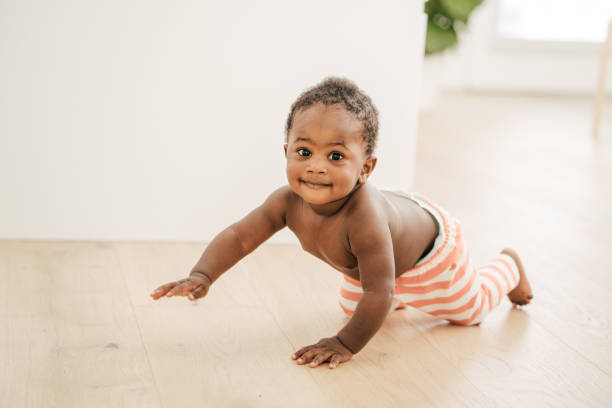 istock Mom playing with baby son 1165361025